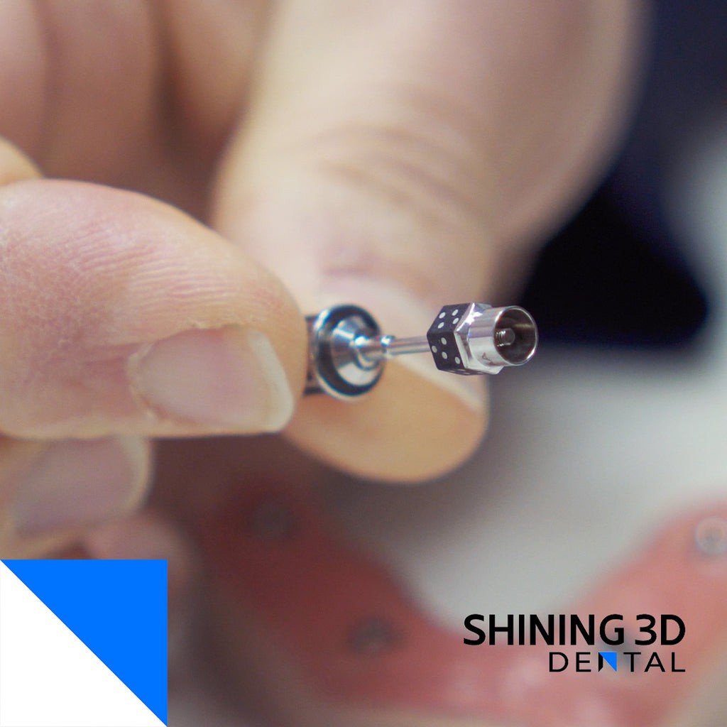 Shining 3D coded scan body screw being inserted into the scan body