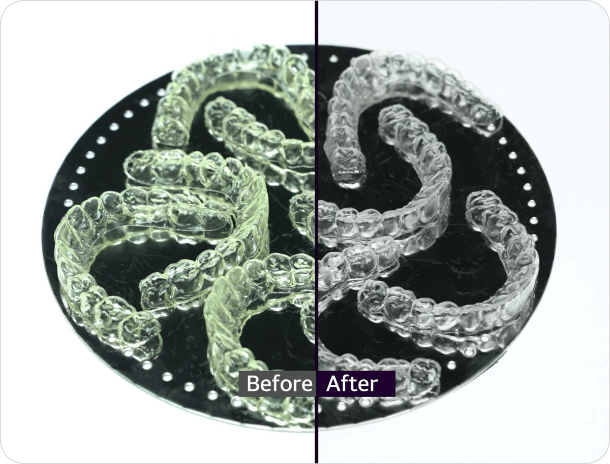 Clear aligners before and after curing in the Graphy Tera Harz Cure nitrogen chamber