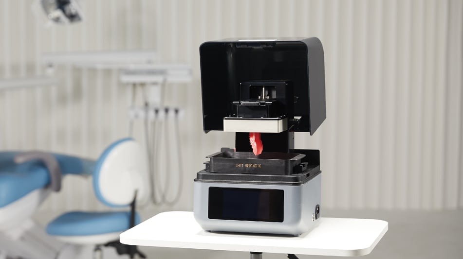 Shining3D AccuFab-Aris printer in a dental office with printed restoration