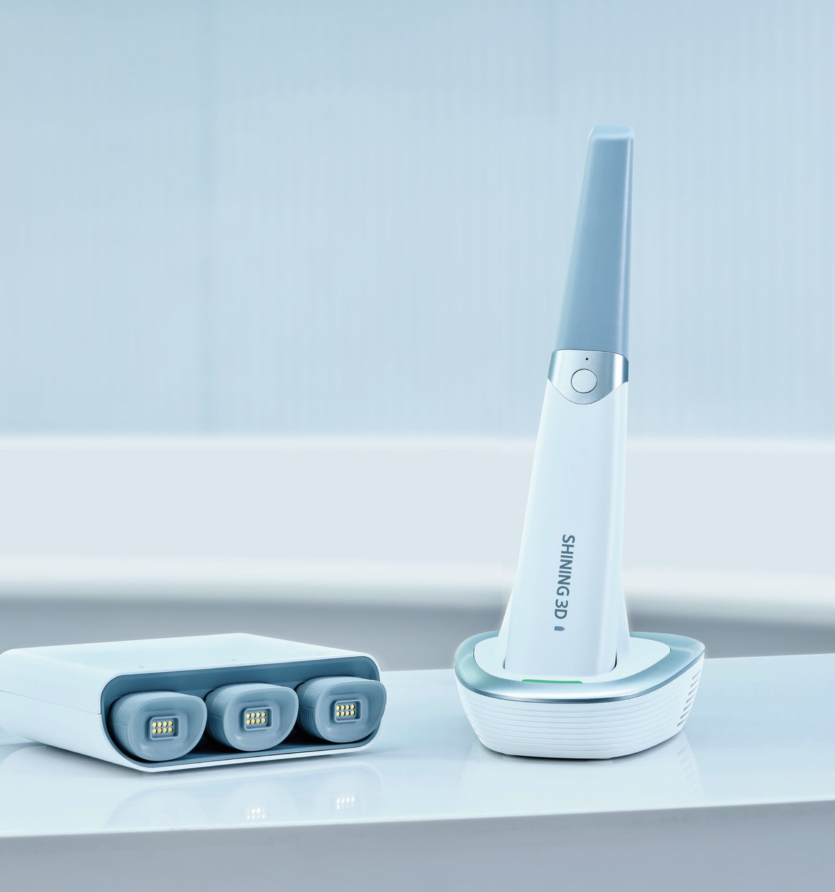 Aoralscan 3 Wireless on charging stand with swappable battery charger