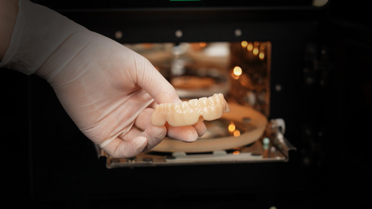 Removing a cured denture from the FabCure N2 chamber